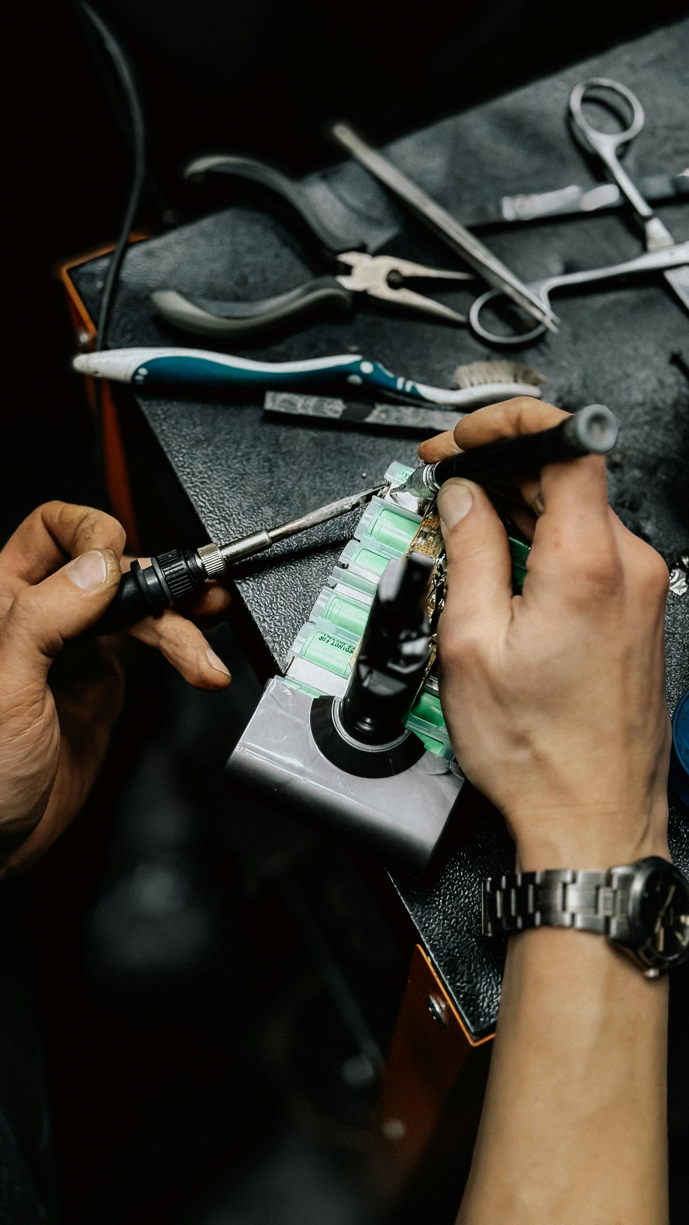 Technician repairing an appliance at our workshop